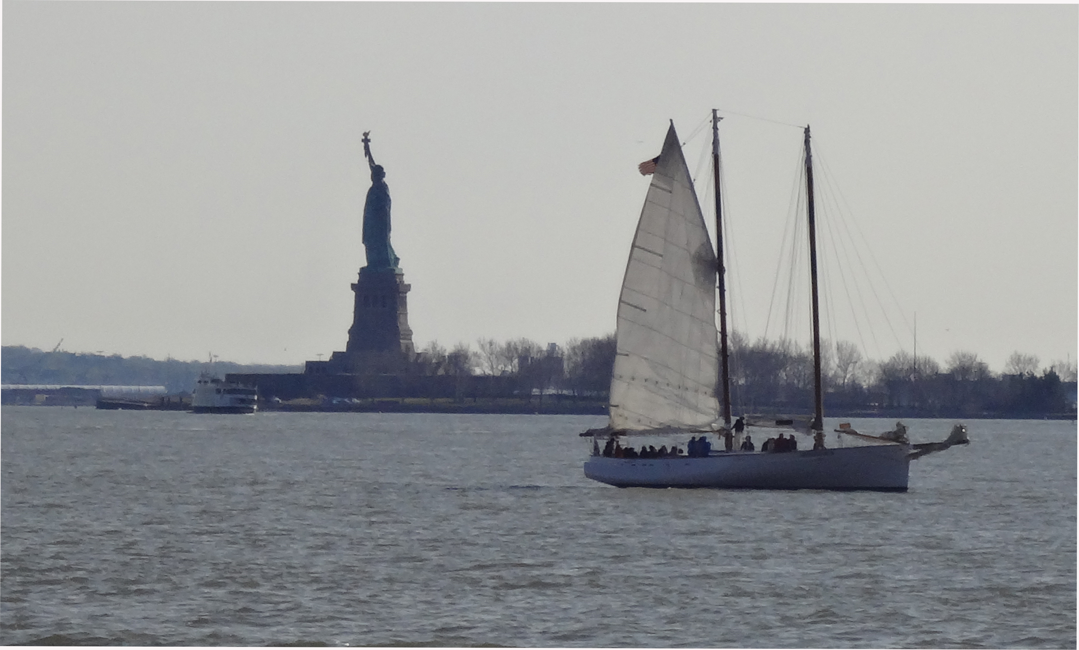 sailboat and statue of liberty