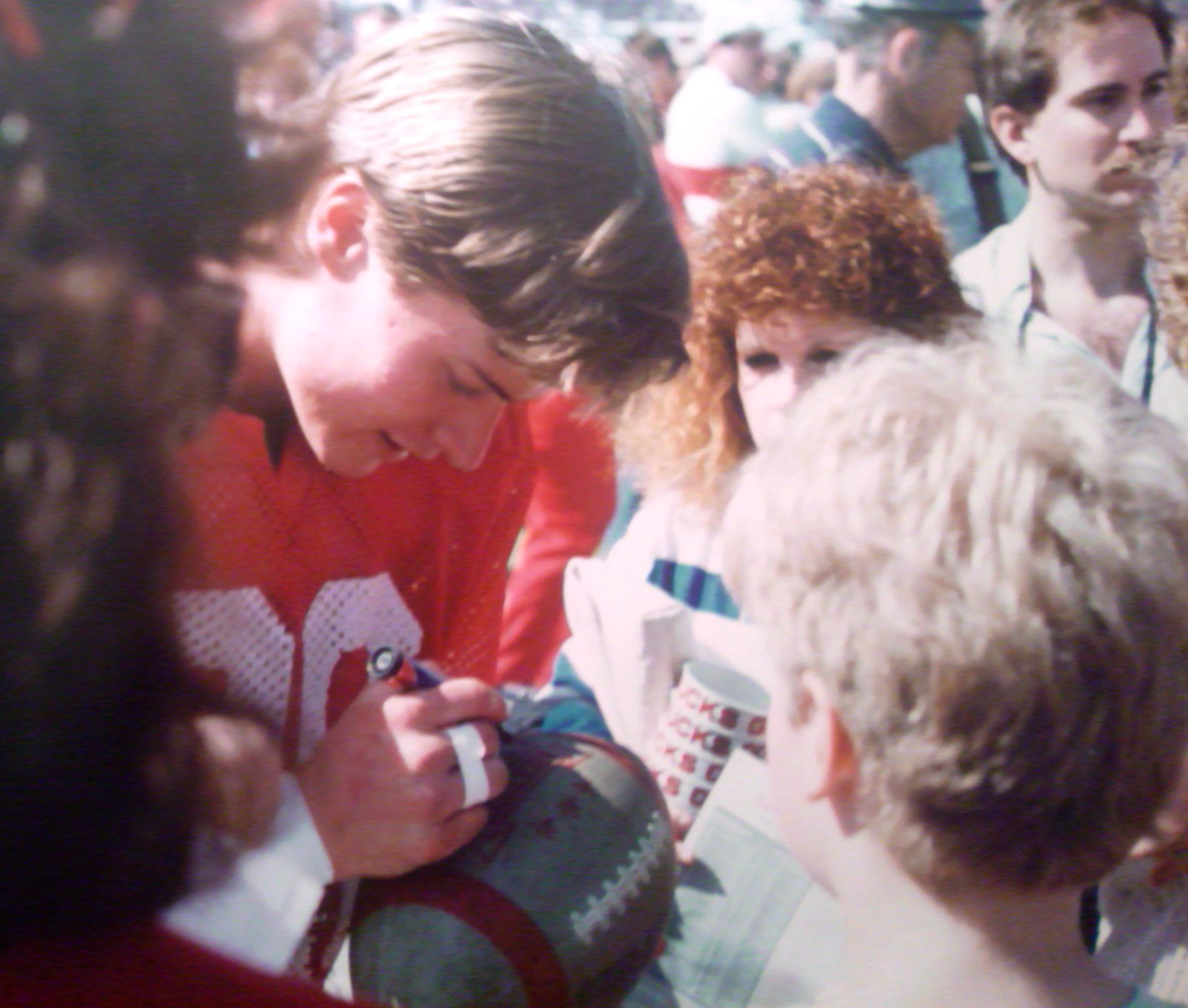 Autographing football 1988 color corrected
