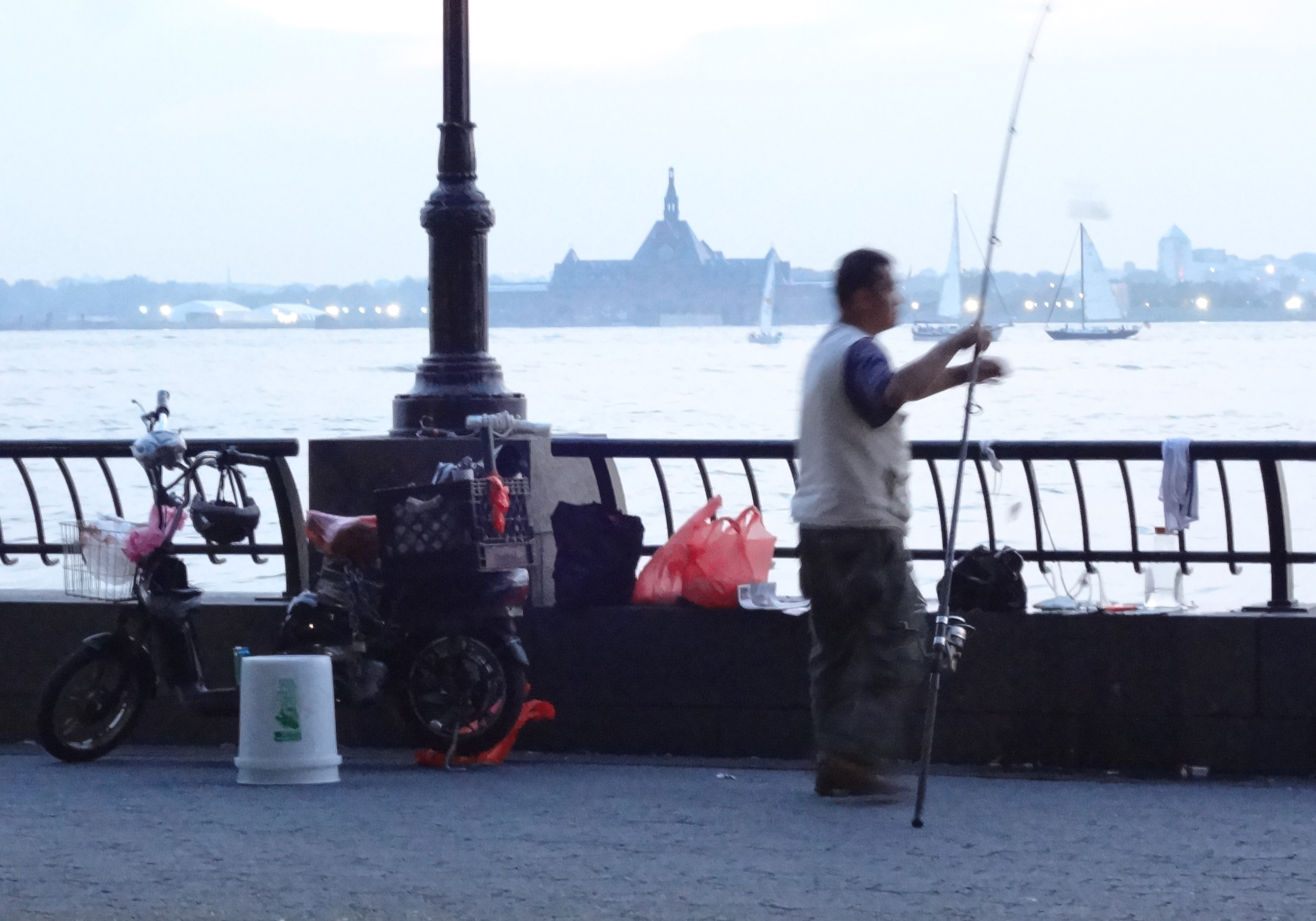 Fisherman on esplanade by West Thames 2