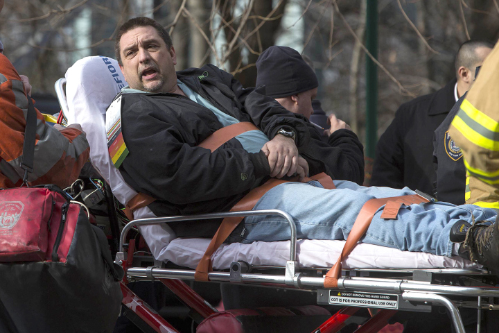 Metro-North engineer William Rockefeller Jr. is loaded into an ambulance after a train derailment in New York