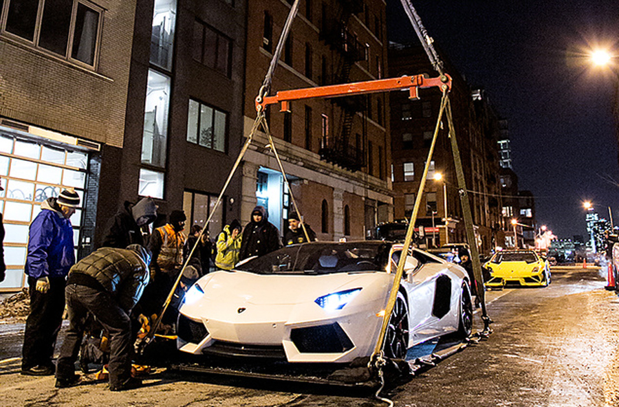 Lamborghini on ground in hoist