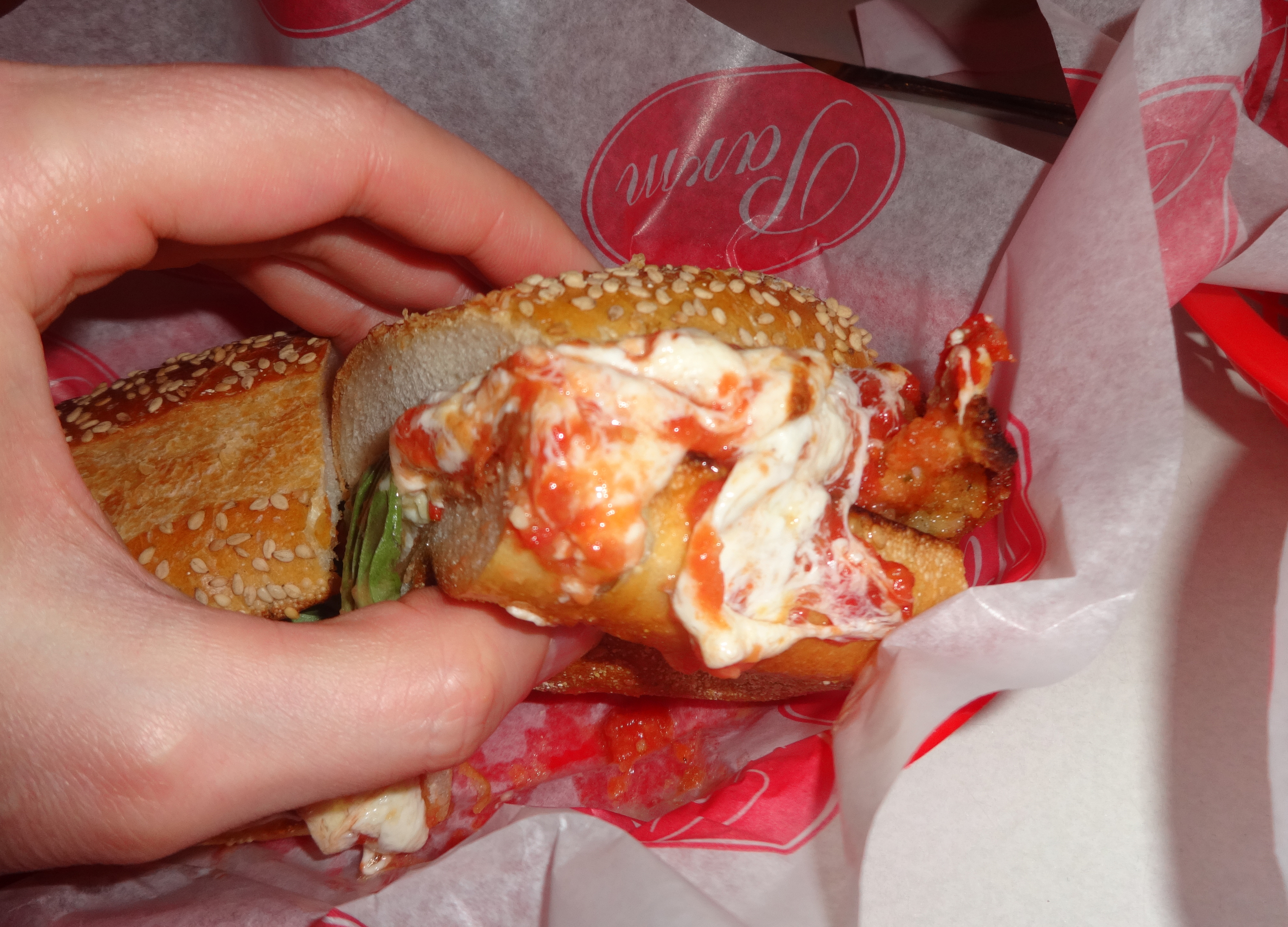 Parm chicken parmesian hoagie holding
